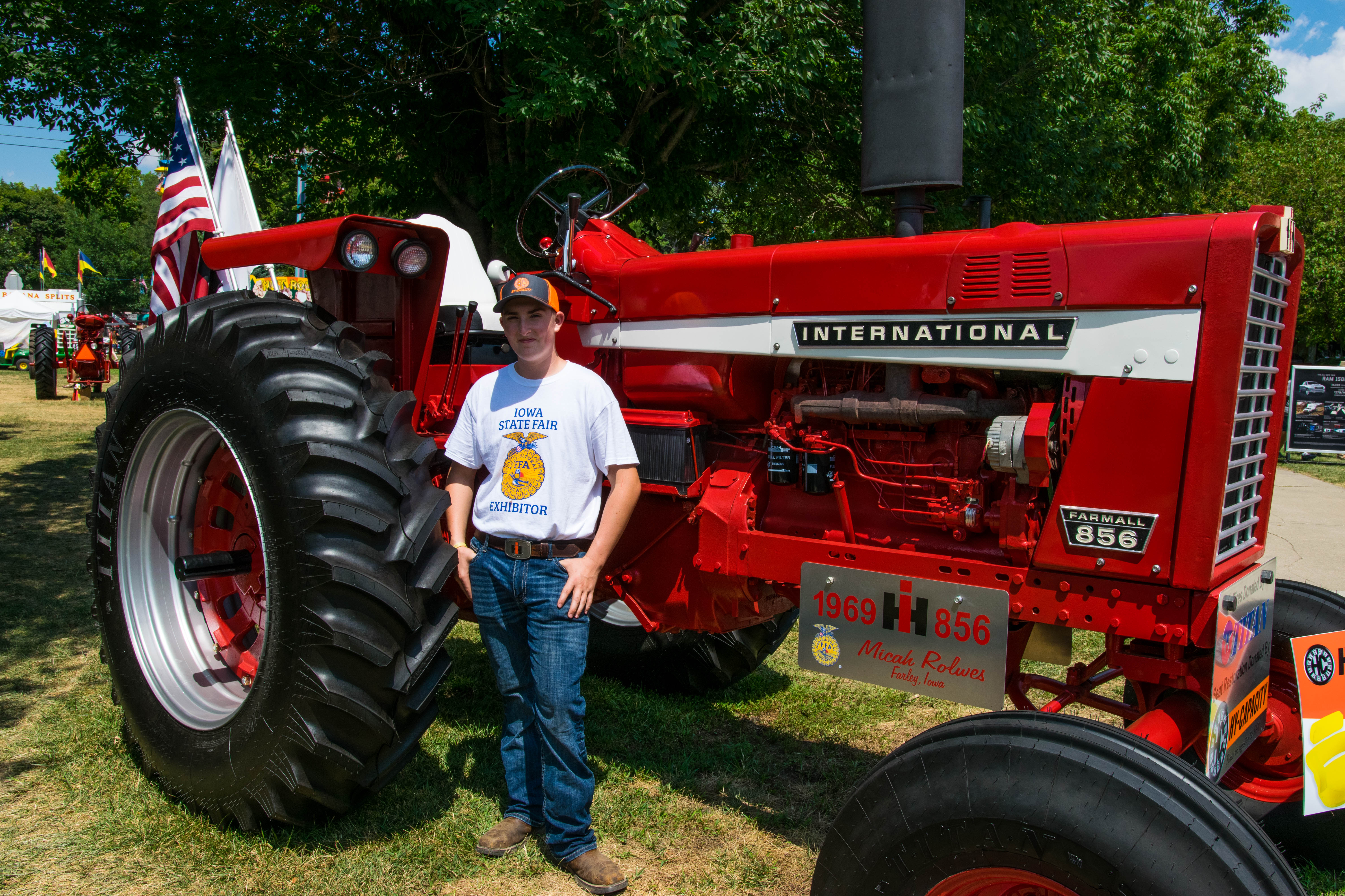 Micah with His Complete International Tractor Restoration at the Iowa State Fair